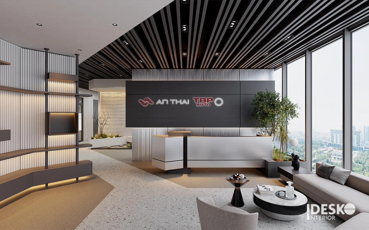 Khu lễ tân hiện đại với đường nét mạnh mẽ, vật liệu sang trọng và nhận diện thương hiệu nổi bật