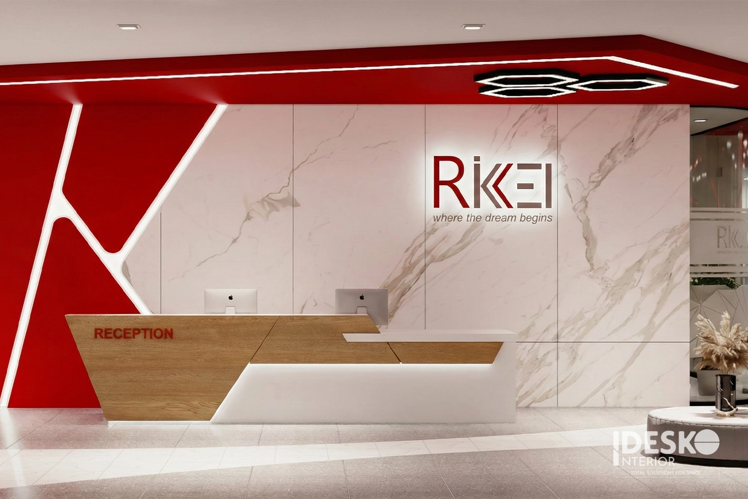 Khu lễ tân văn phòng công nghệ Rikkei với màu đỏ nổi bật, thiết kế hiện đại và nhận diện thương hiệu rõ nét