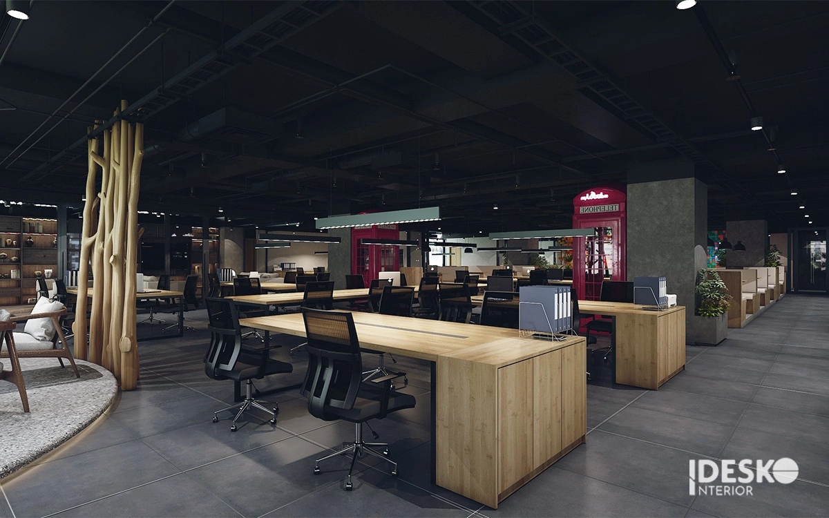 Không gian làm việc mở với trần nhà cao, hệ thống ống thông gió lộ ra ngoài và tường gạch mộc